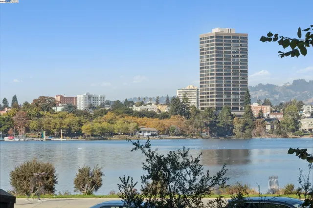 a view of staircase with lots of frames on wall