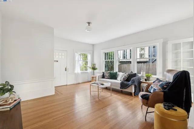 a vase of flowers sitting on a table with a couch