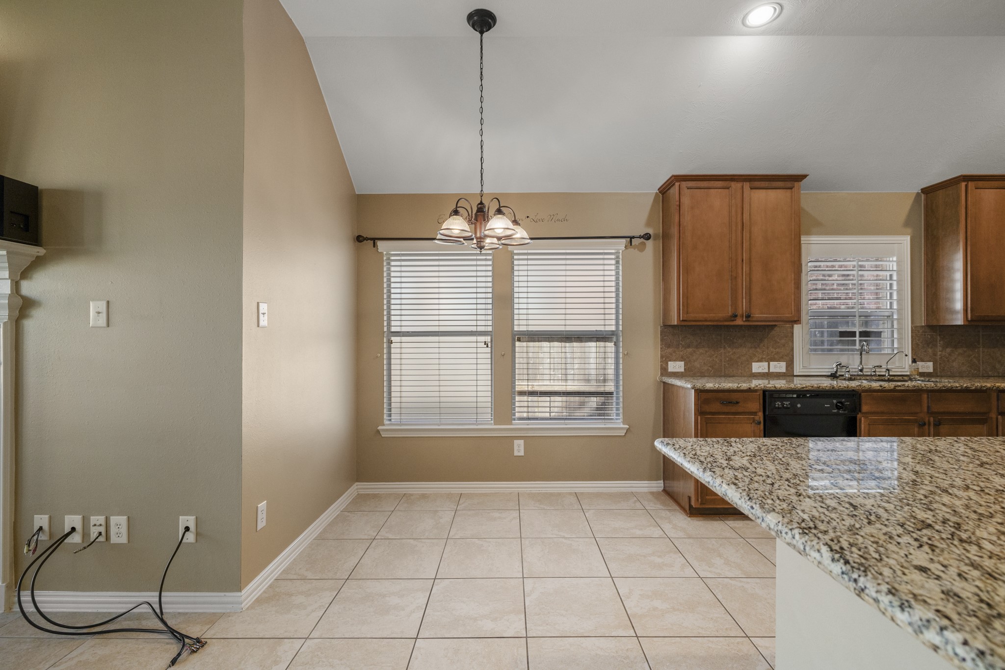 20014 Queens Oak Court Spring, TX 77379 - Photo 12 of 49 a kitchen with granite countertop a stove a sink and a granite counter tops
