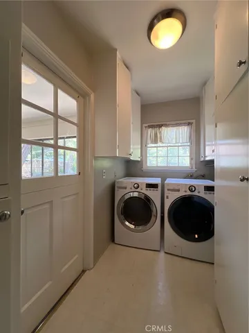 a kitchen with a refrigerator and a stove
