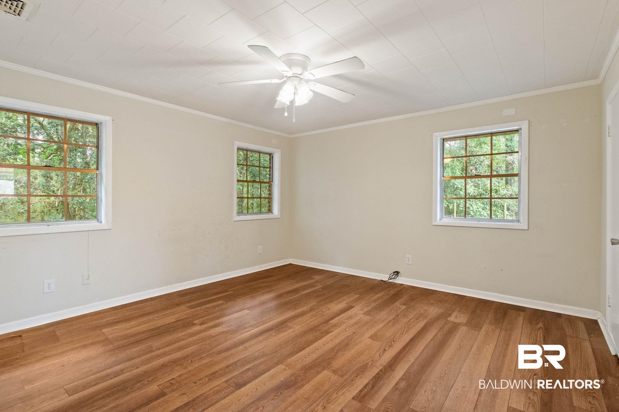 384 Old Bratt Road Atmore, AL 36502 - Photo 34 of 64 Spacious room featuring wood-finish flooring and neutral wall tones