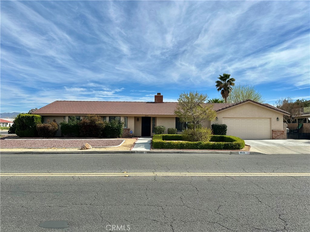 18143 Kalin Ranch Drive Victorville, CA 92395 - Photo 2 of 28 a view of a house with a yard and plants