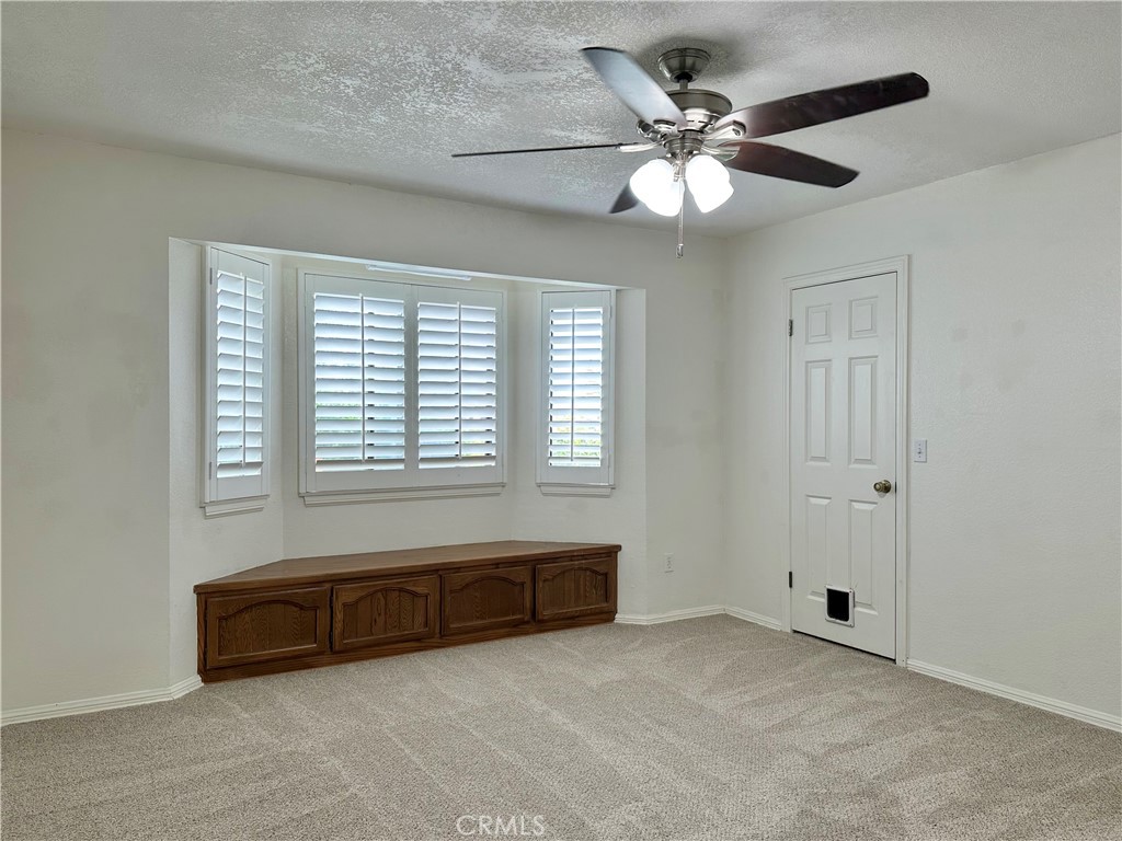 18143 Kalin Ranch Drive Victorville, CA 92395 - Photo 21 of 28 a bathroom with a bathtub and a ceiling fan