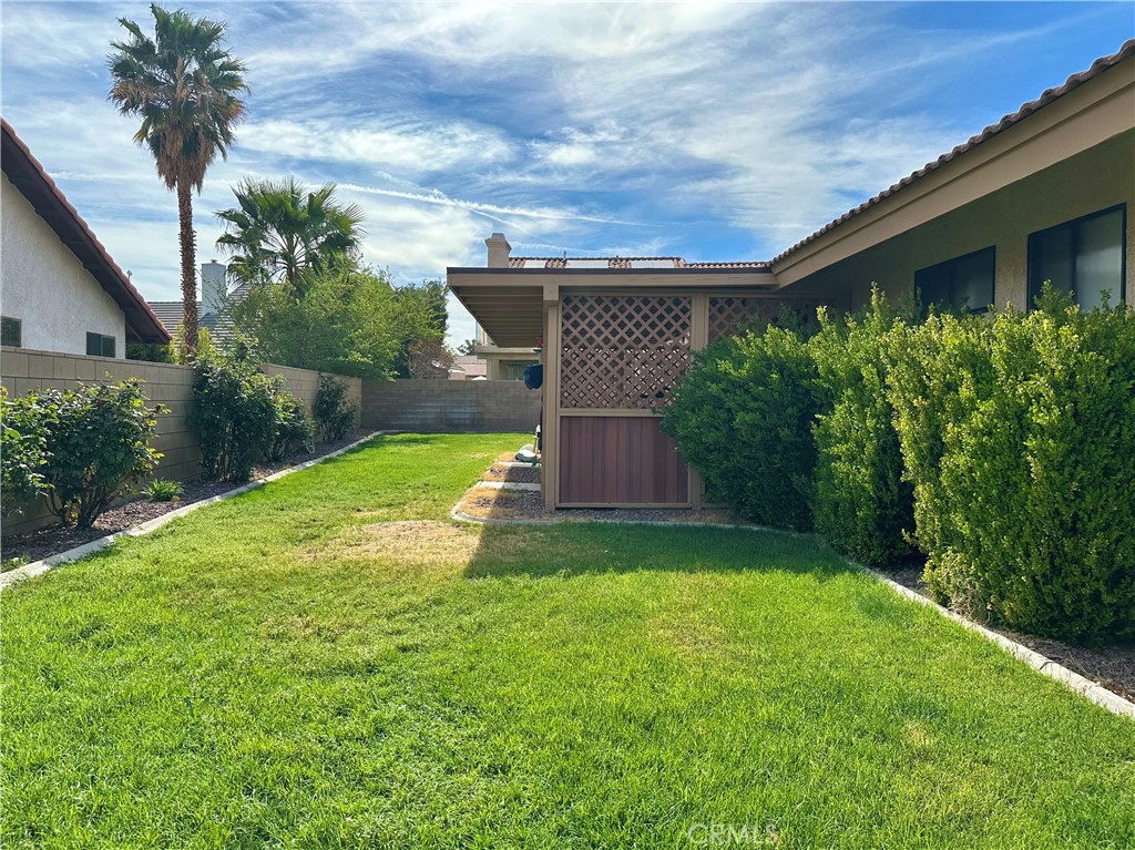 18143 Kalin Ranch Drive Victorville, CA 92395 - Photo 26 of 28 a view of a backyard with a plants