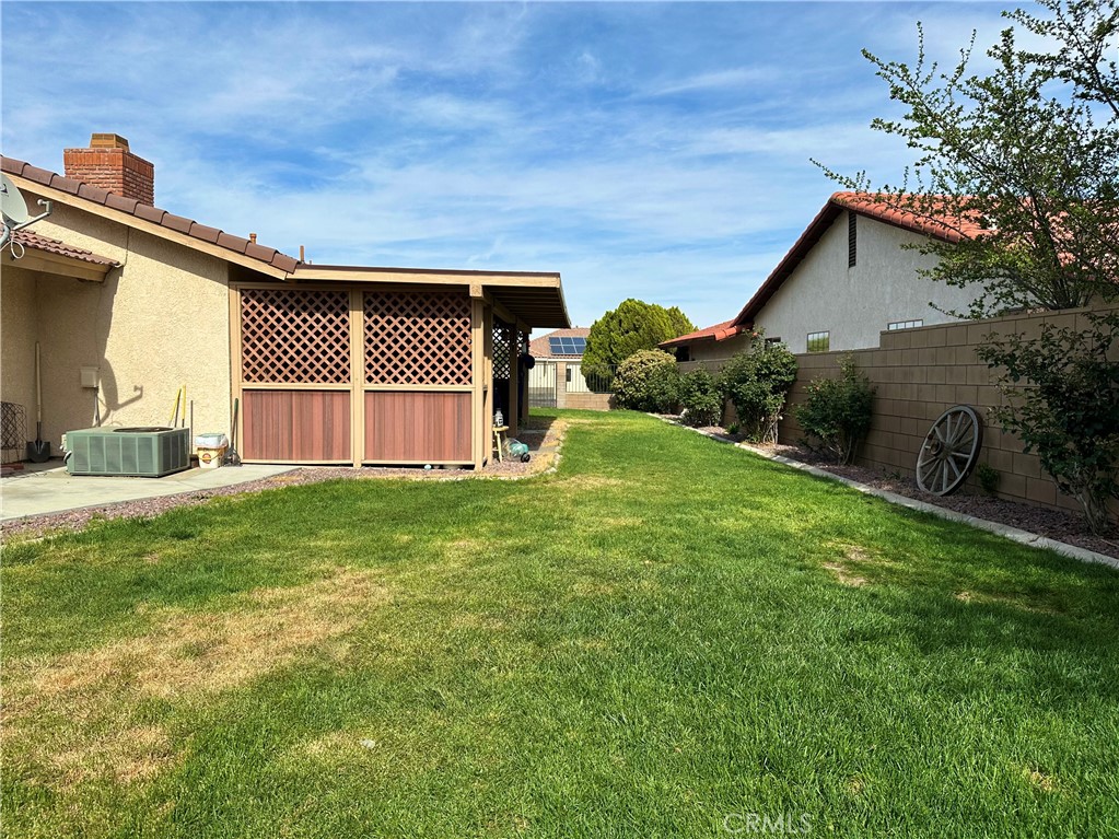18143 Kalin Ranch Drive Victorville, CA 92395 - Photo 28 of 28 a front view of a house with a garden