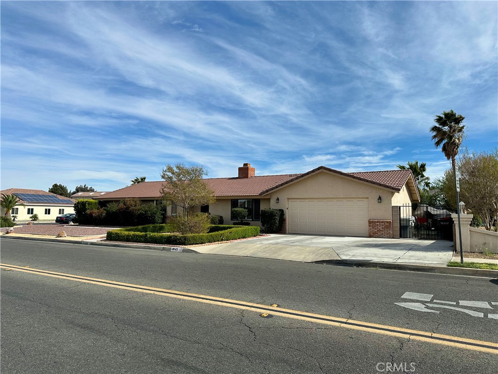 18143 Kalin Ranch Drive Victorville, CA 92395 - Photo 3 of 28 a view of a car parked on the side of the road