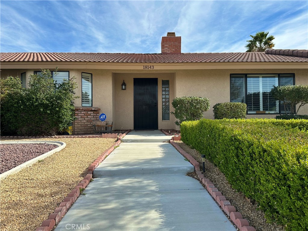 18143 Kalin Ranch Drive Victorville, CA 92395 - Photo 7 of 28 a view of a house with potted plants