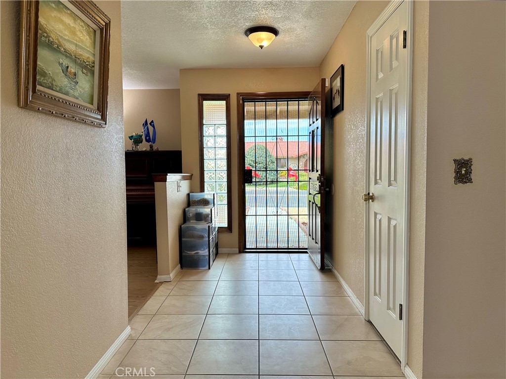 18143 Kalin Ranch Drive Victorville, CA 92395 - Photo 8 of 28 a view of a hallway to rooms and stairs