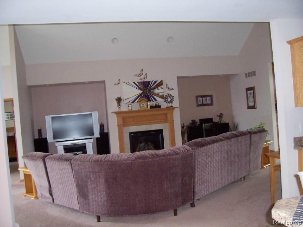 14470 Hough Road Allenton, MI 48002 - Photo 6 of 39 living room with gas fireplace