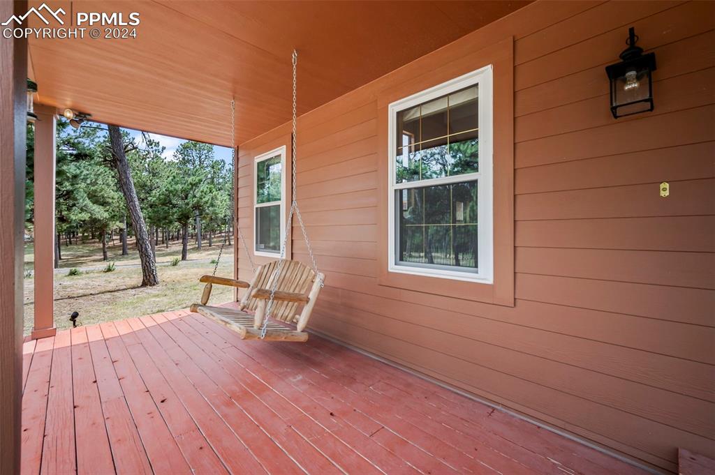 14560 Spiritwood Loop Elbert, CO 80106 - Photo 14 of 44 a view of a house with backyard and sitting area