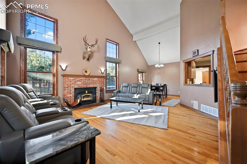 14560 Spiritwood Loop Elbert, CO 80106 - Photo 16 of 44 a living room with furniture fireplace and window