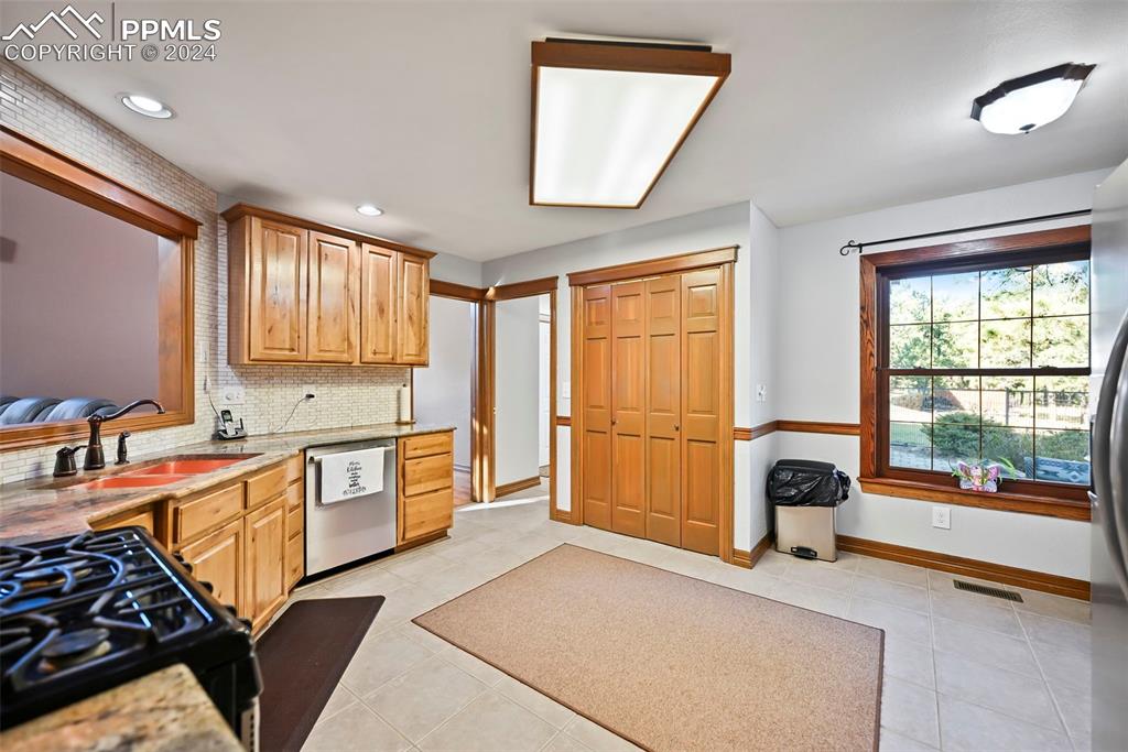14560 Spiritwood Loop Elbert, CO 80106 - Photo 24 of 44 a bedroom with furniture and a large window