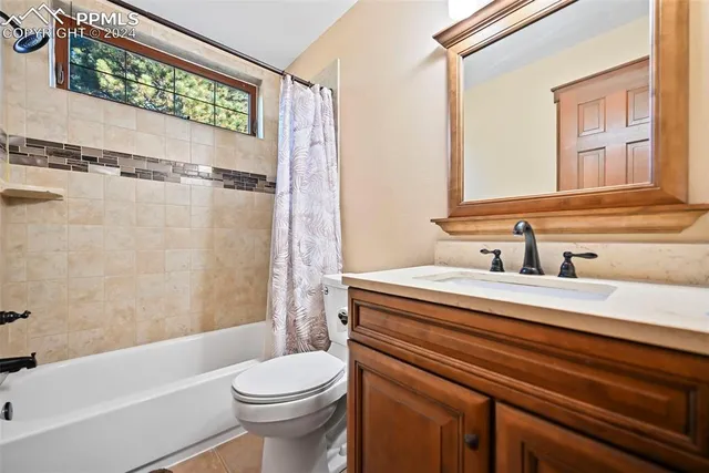 a bathroom with a sink a toilet and a bathtub