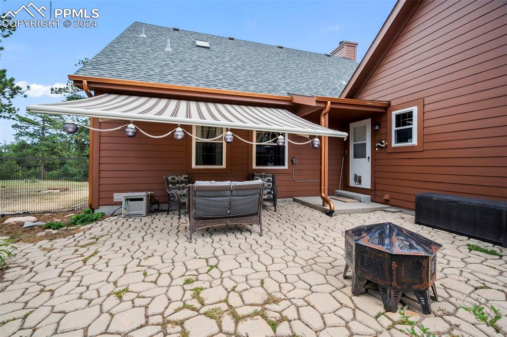 14560 Spiritwood Loop Elbert, CO 80106 - Photo 34 of 44 a backyard of a house with seating space