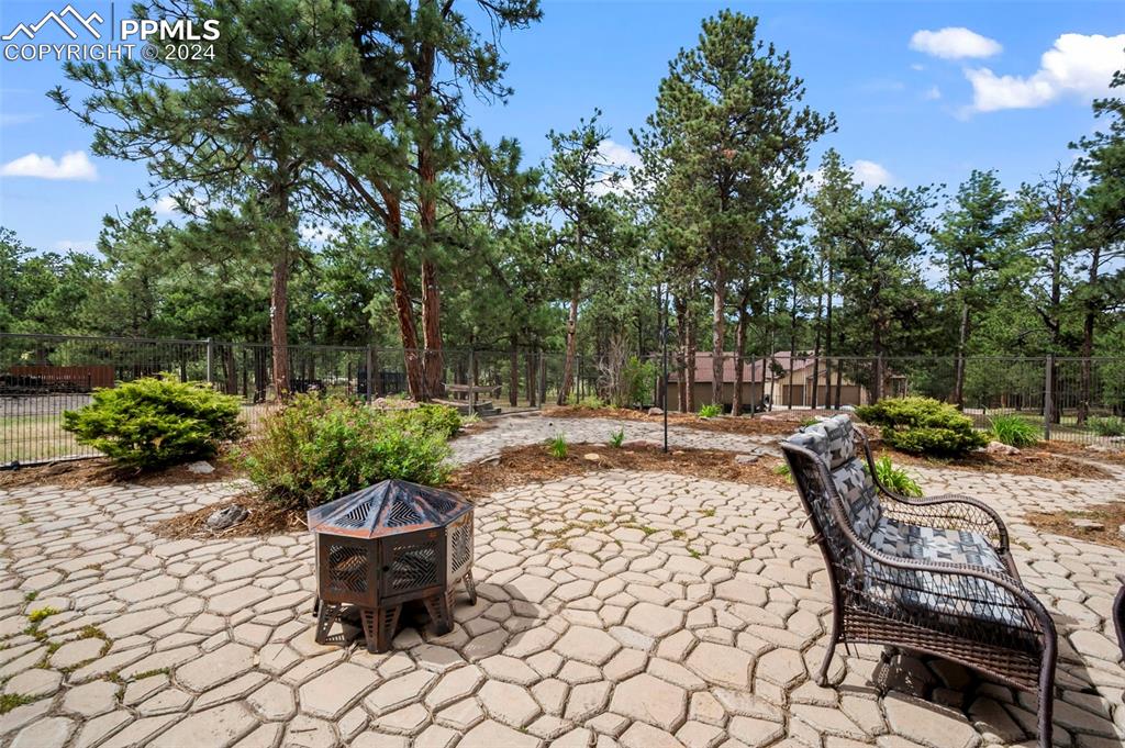 14560 Spiritwood Loop Elbert, CO 80106 - Photo 37 of 44 a view of a backyard with sitting area