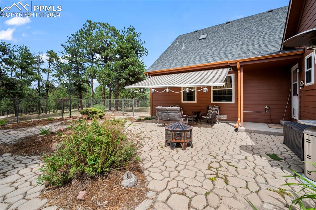 14560 Spiritwood Loop Elbert, CO 80106 - Photo 41 of 44 a view of a backyard with table and chairs