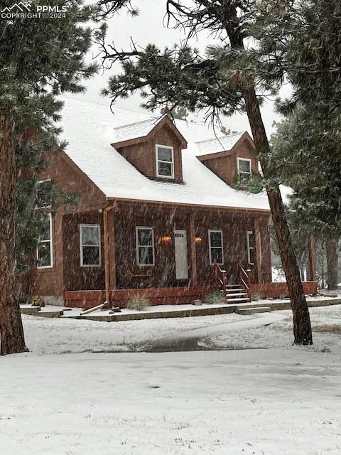 14560 Spiritwood Loop Elbert, CO 80106 - Photo 7 of 44 a front view of a house with a yard