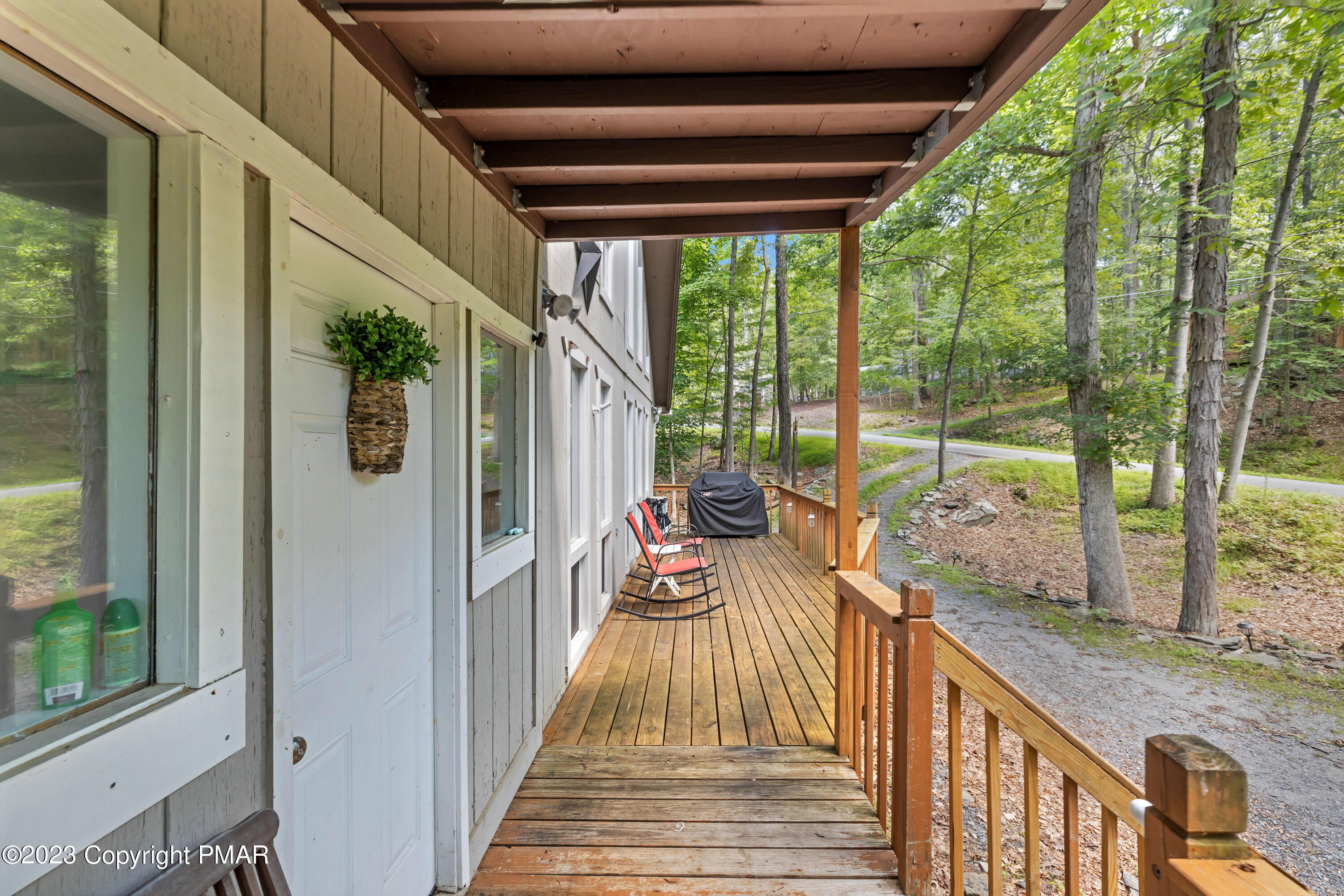 167 Salisbury Road Bushkill, PA 18324 - Photo 3 of 38 a view of a porch with wooden floor and furniture