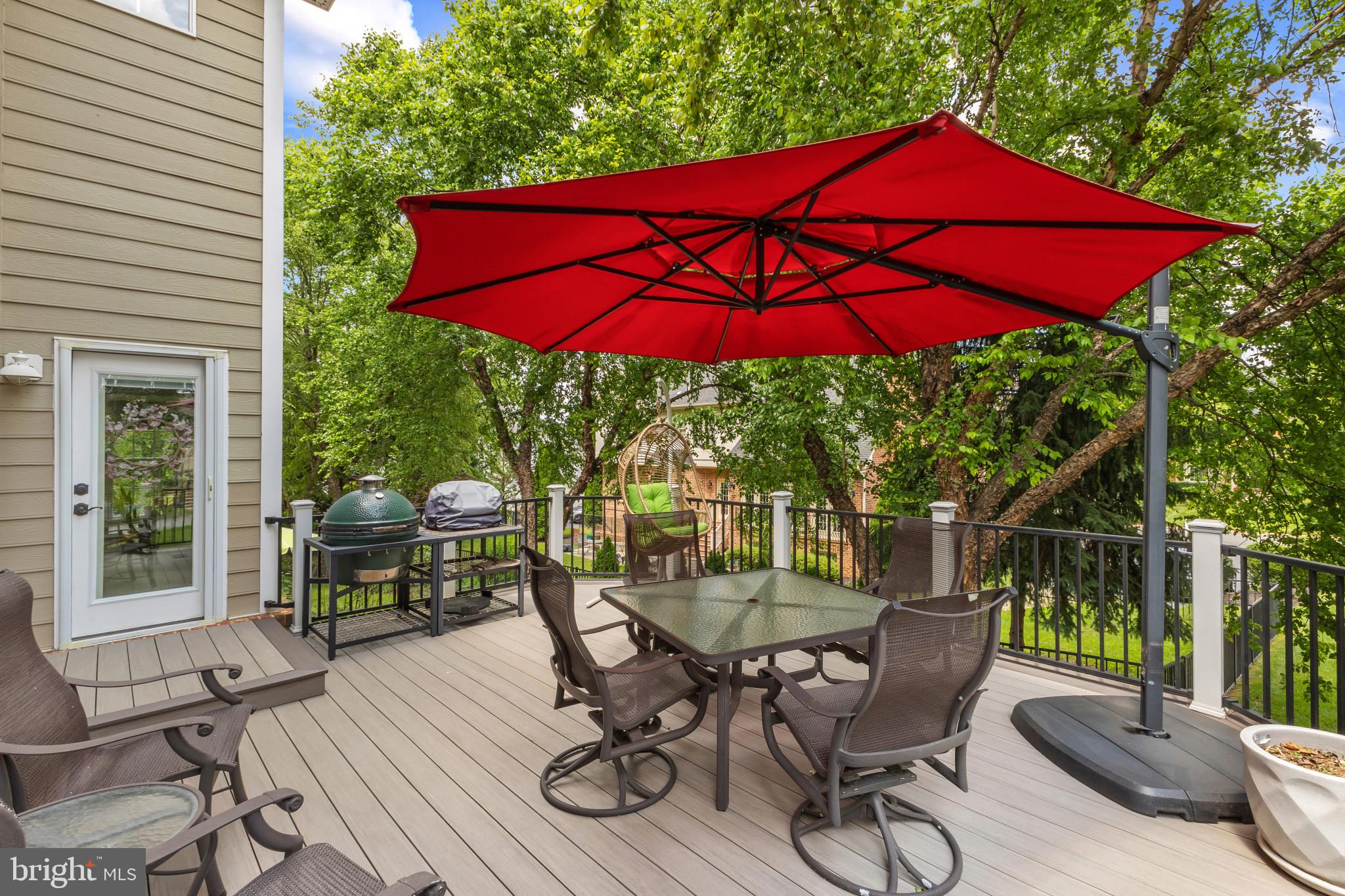 15006 Ransom Oaks Court Gainesville, VA 20155 - Photo 36 of 57 Charming deck with vibrant umbrella