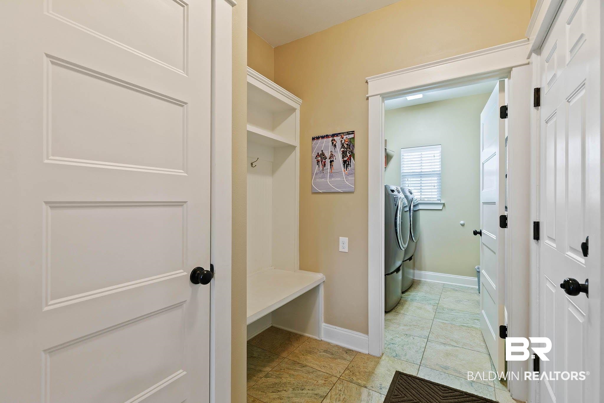19740 Bunker Loop Fairhope, AL 36532 - Photo 15 of 33 Mudroom with washing machine and dryer and baseboards