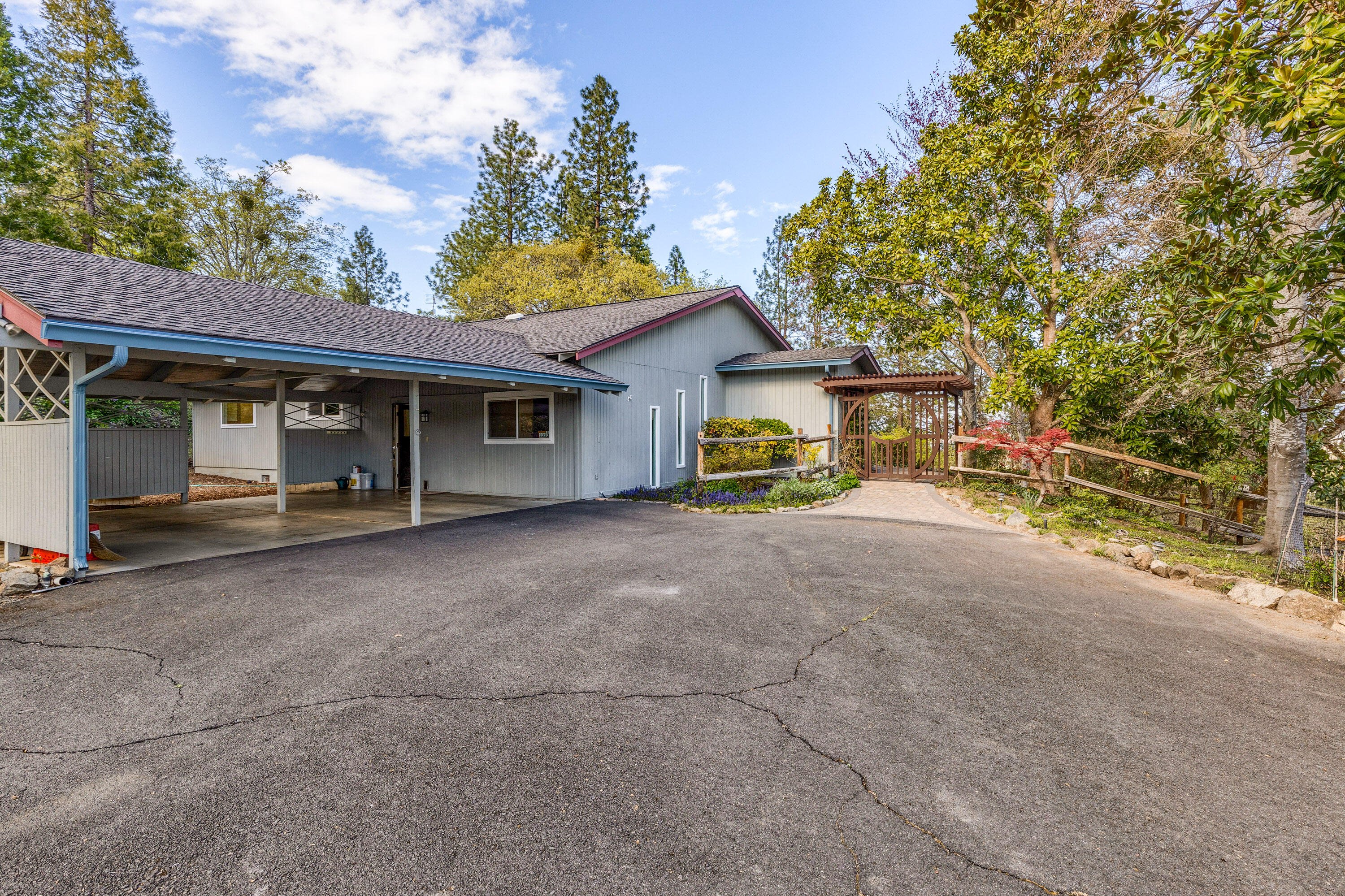 3333 Old Stage Road Central Point, OR 97502 - Photo 3 of 68 a view of a house with backyard and a tree