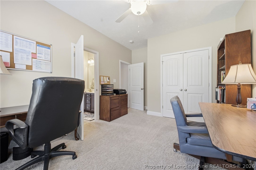 2589 June Johnson Road Raeford, NC 28376 - Photo 34 of 49 a view of a workspace with furniture and a couch