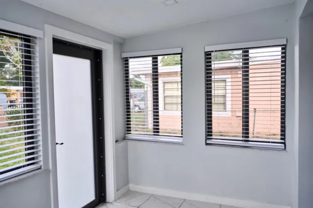 a view of an empty room with a window