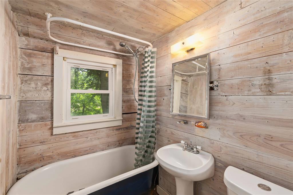 701 4th Street Goldthwaite, TX 76844 - Photo 22 of 32 a bathroom with a sink toilet and shower
