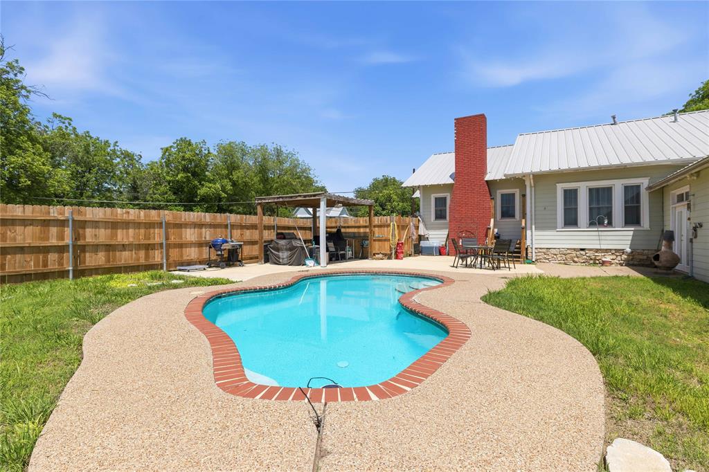 701 4th Street Goldthwaite, TX 76844 - Photo 5 of 32 a view of a swimming pool with a patio