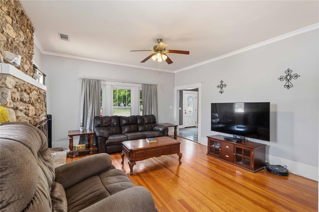 701 4th Street Goldthwaite, TX 76844 - Photo 7 of 32 a living room with furniture and a flat screen tv