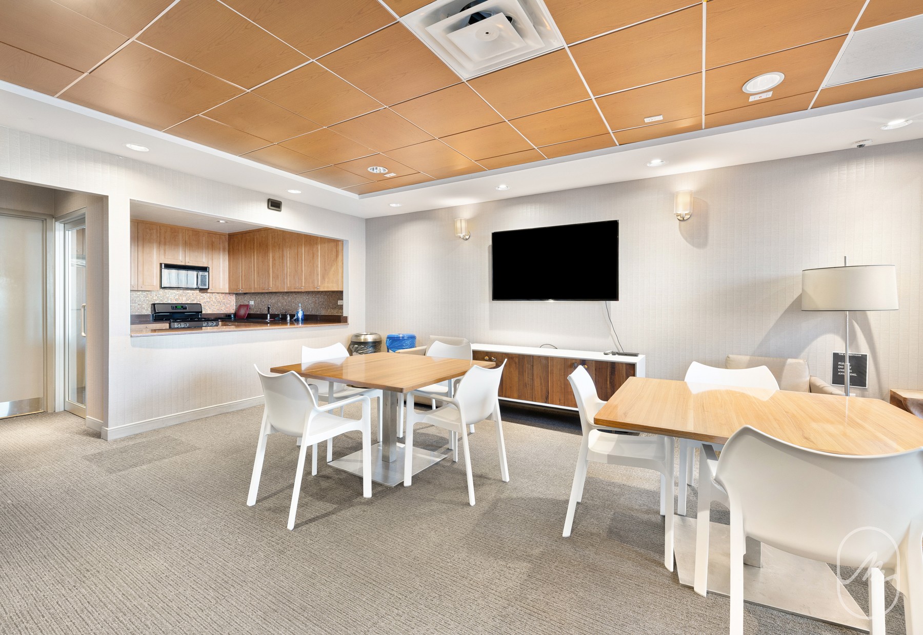 330 East 38th Street, Unit 23Q Manhattan, NY 10016 - Photo 19 of 30 a dining room with a wooden table and chairs