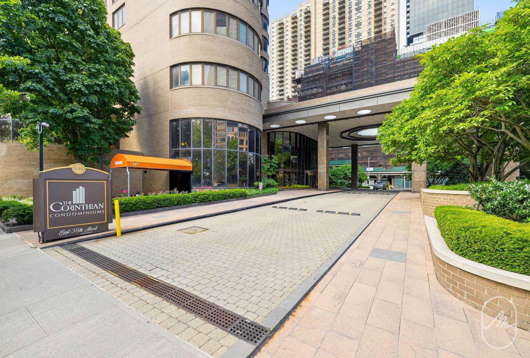 330 East 38th Street, Unit 23Q Manhattan, NY 10016 - Photo 28 of 30 a front view of a building with garden