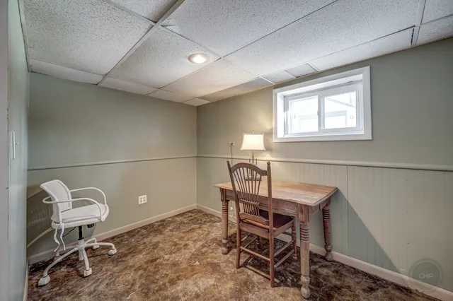 a workspace with furniture and a window