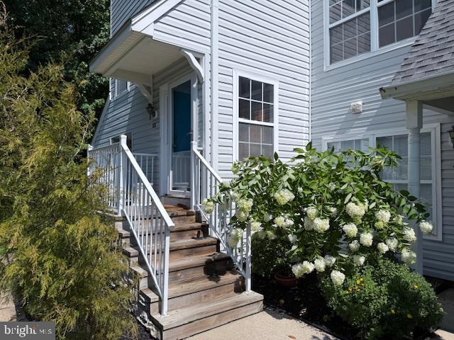 a view of a house with a flower garden
