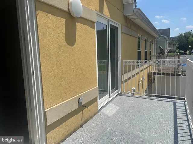 a view of balcony with furniture