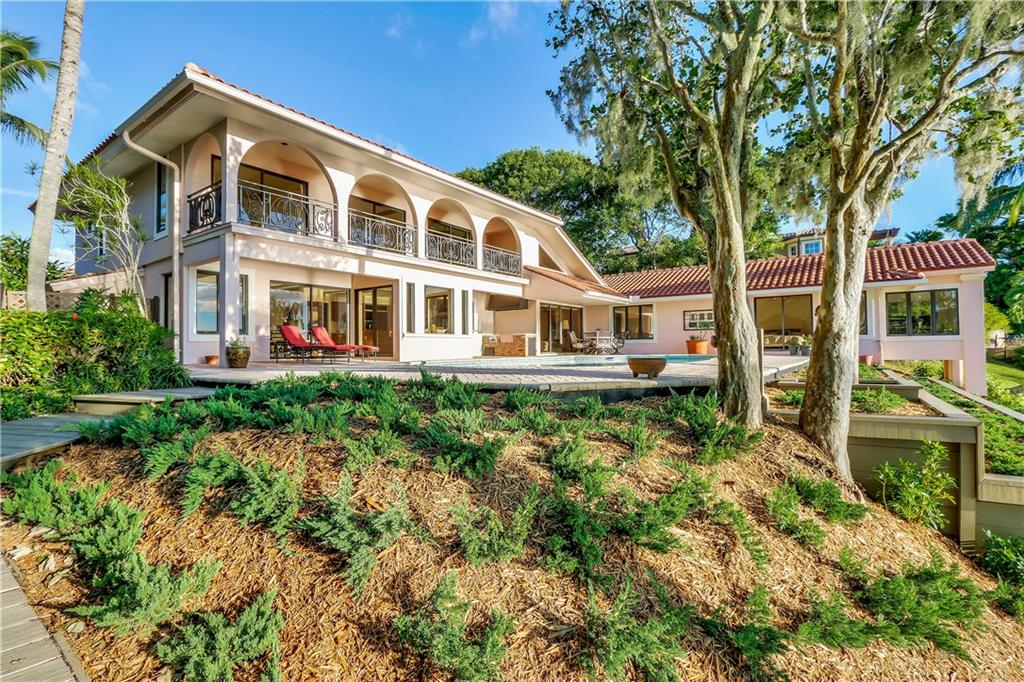 171 South River Road Stuart, FL 34996 - Photo 14 of 68 a front view of a house with a yard