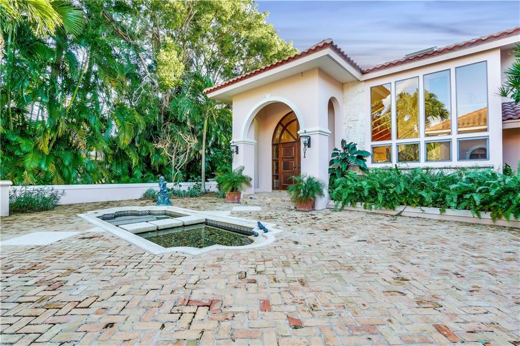 171 South River Road Stuart, FL 34996 - Photo 17 of 68 a front view of a house with garden