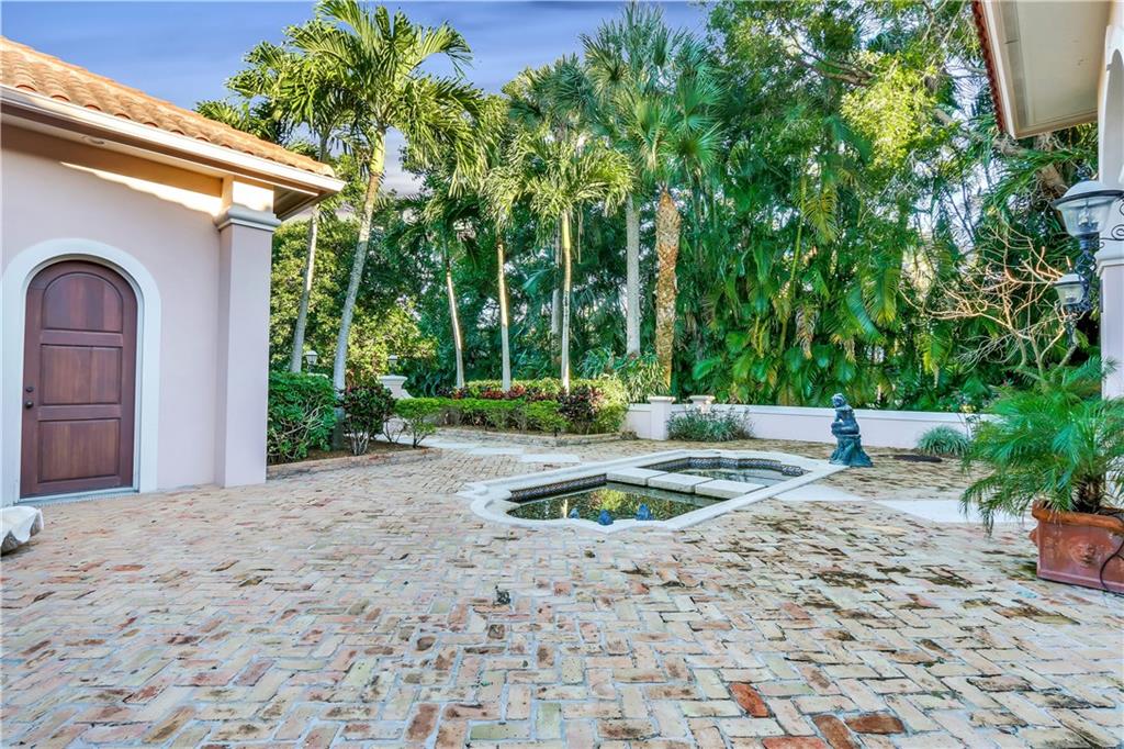 171 South River Road Stuart, FL 34996 - Photo 18 of 68 a view of a yard with plants and trees