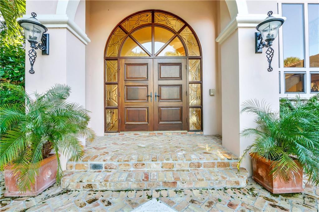 171 South River Road Stuart, FL 34996 - Photo 19 of 68 a front view of a house with garden