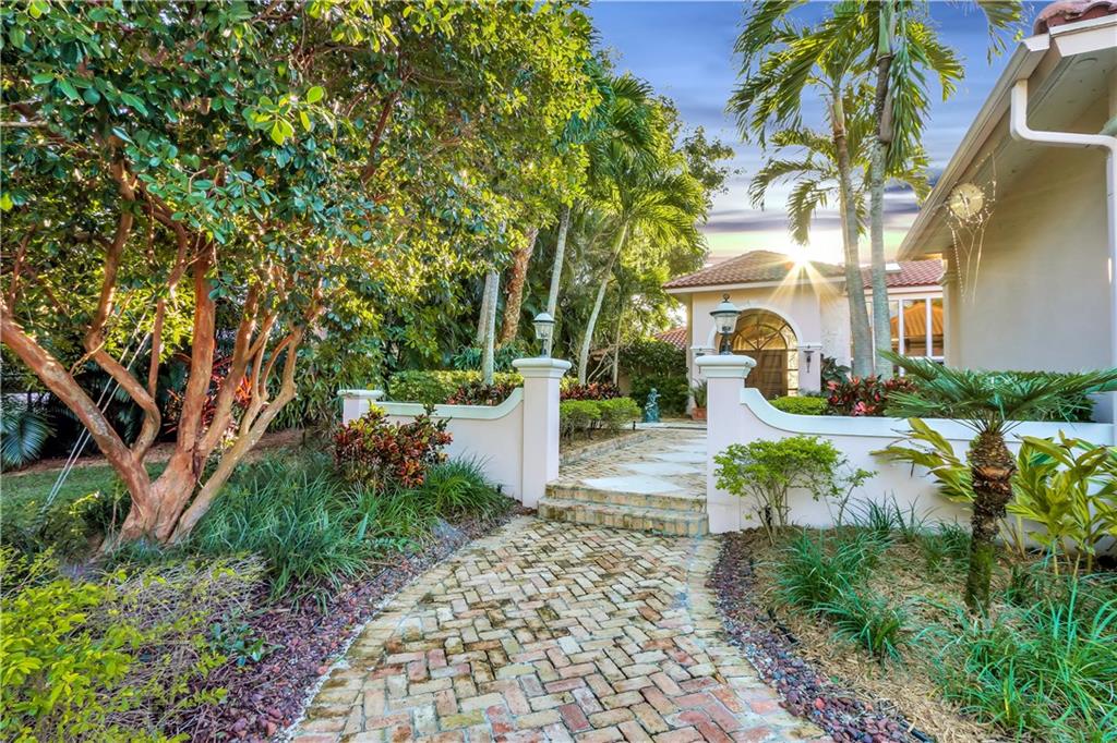 171 South River Road Stuart, FL 34996 - Photo 20 of 68 a view of a garden with a fountain