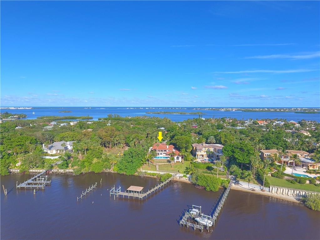 171 South River Road Stuart, FL 34996 - Photo 27 of 68 an aerial view of a houses with a lake view