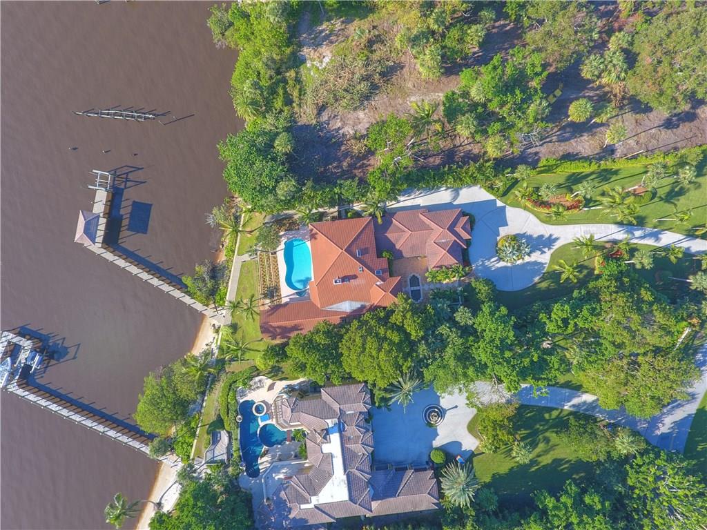 171 South River Road Stuart, FL 34996 - Photo 31 of 68 an aerial view of a house with a yard