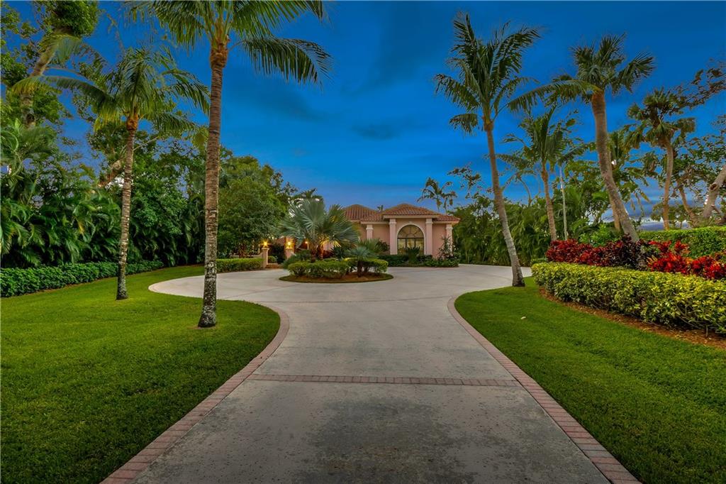 171 South River Road Stuart, FL 34996 - Photo 32 of 68 a view of a street with a building and a street sign