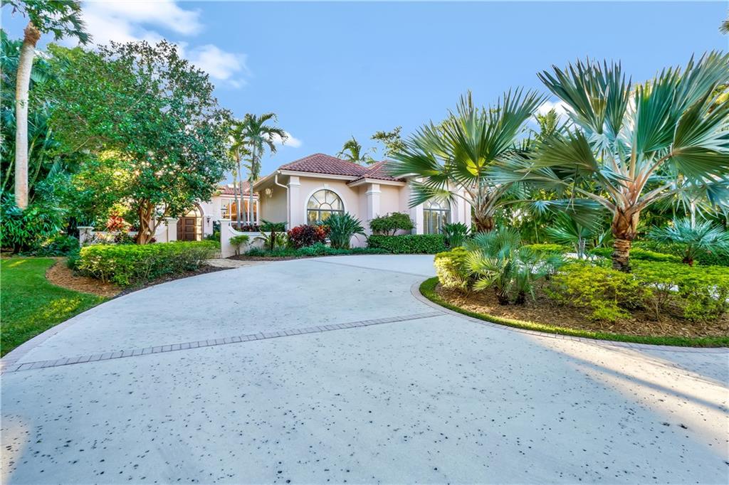 171 South River Road Stuart, FL 34996 - Photo 34 of 68 a view of a garden with a house