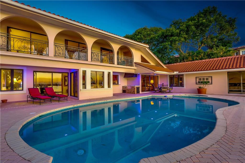 171 South River Road Stuart, FL 34996 - Photo 4 of 68 front view of a house with a swimming pool