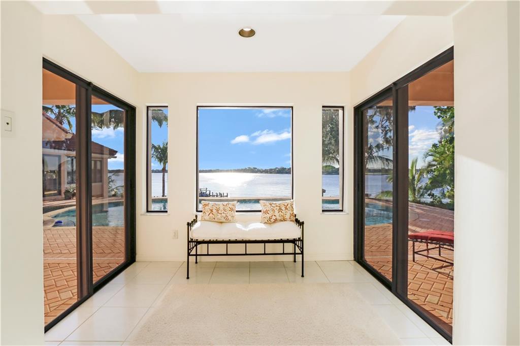 171 South River Road Stuart, FL 34996 - Photo 48 of 68 a bedroom with furniture and large window