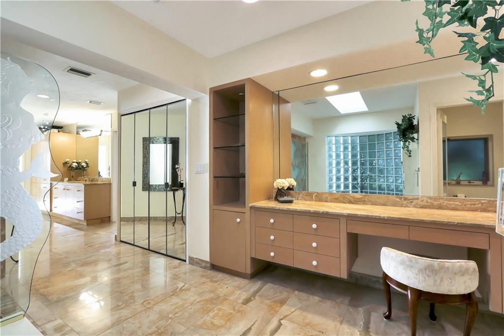 171 South River Road Stuart, FL 34996 - Photo 54 of 68 a spacious bathroom with a tub sink and mirror