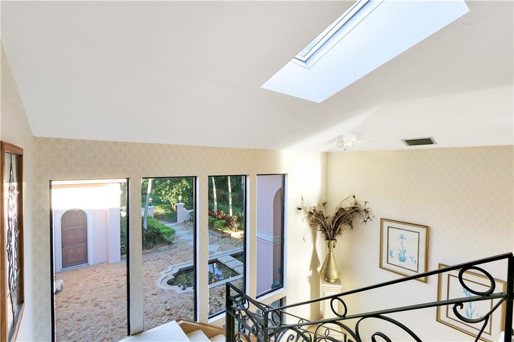 171 South River Road Stuart, FL 34996 - Photo 55 of 68 a living room with furniture and a potted plant