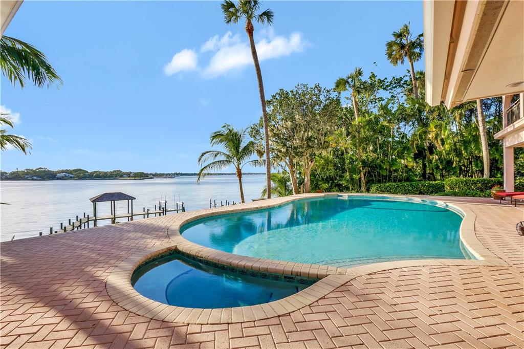171 South River Road Stuart, FL 34996 - Photo 6 of 68 a view of swimming pool with outdoor seating and plants