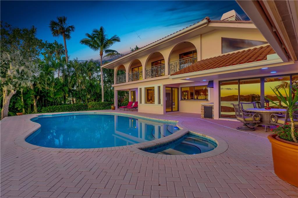 171 South River Road Stuart, FL 34996 - Photo 9 of 68 a view of a house with swimming pool and sitting area